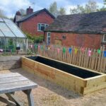 An empty raised bed planter