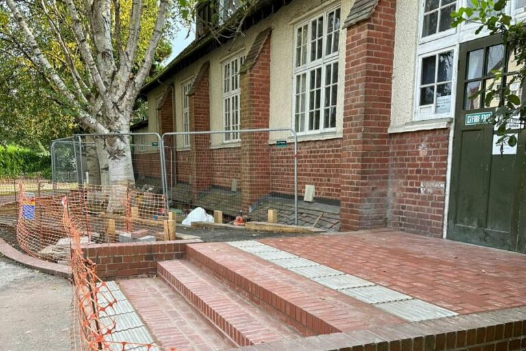 The side door of Moor Pool Hall with newly-built steps and ramp